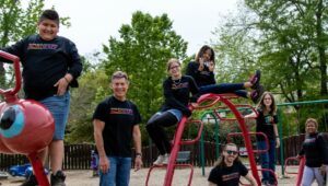 a group of people standing on a playground